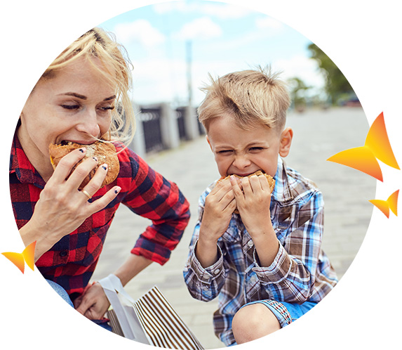 Mother and son eating sandwiches