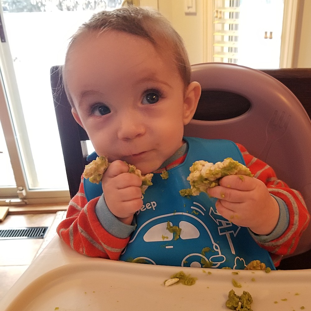 Henri eating high chair