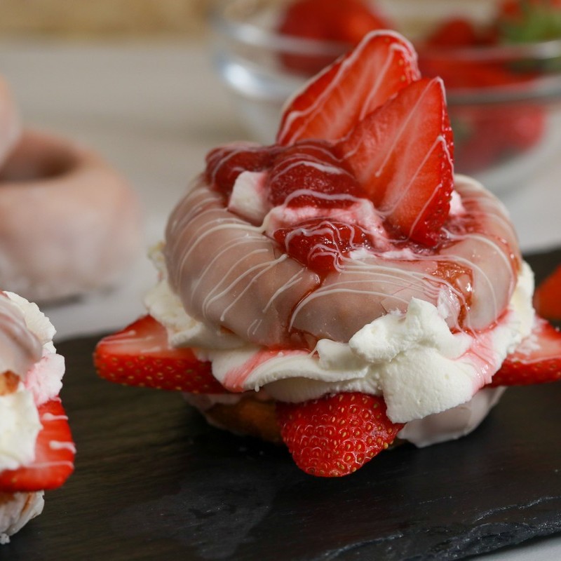 Vanilla donut topped with strawberries & cream