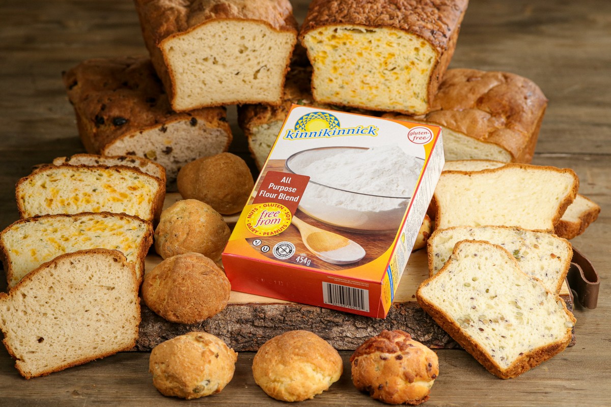 Gluten-free flours on a board with All Purpose Flour Blend Box on top