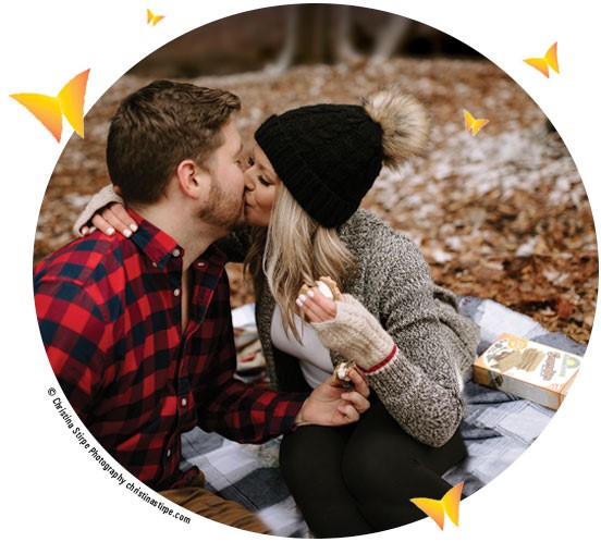 Couple kissing sharing a box of Smores