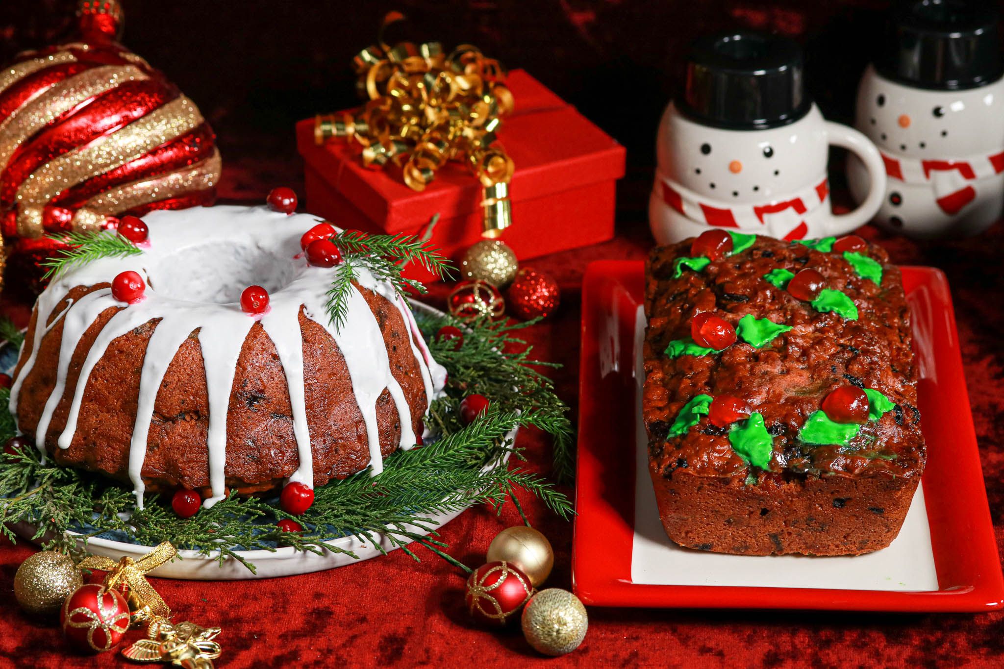 Christmas Fruit Cakes side by side on red velvet