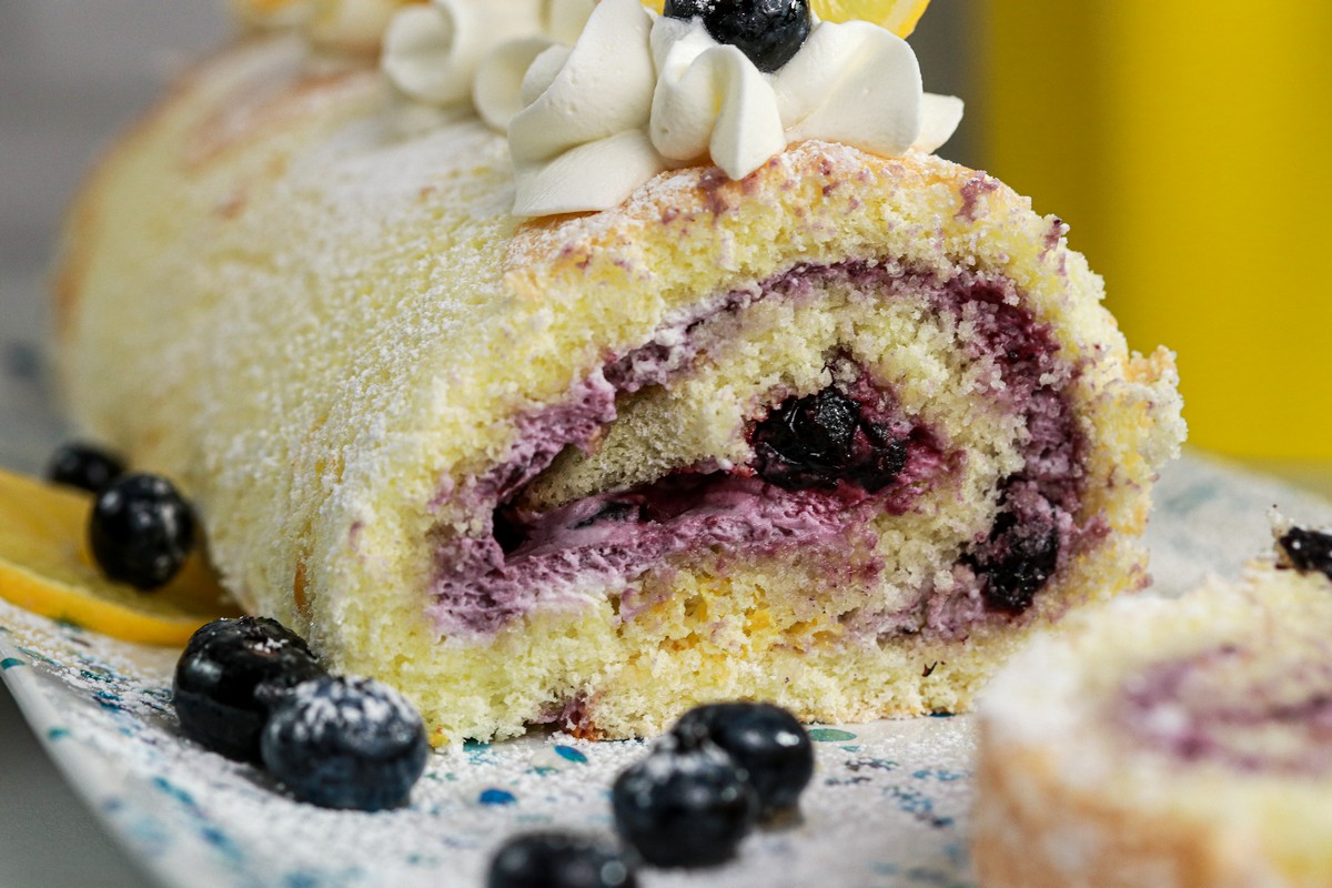 Gluten-free Lemon Blueberry Jelly Roll on blue white plate