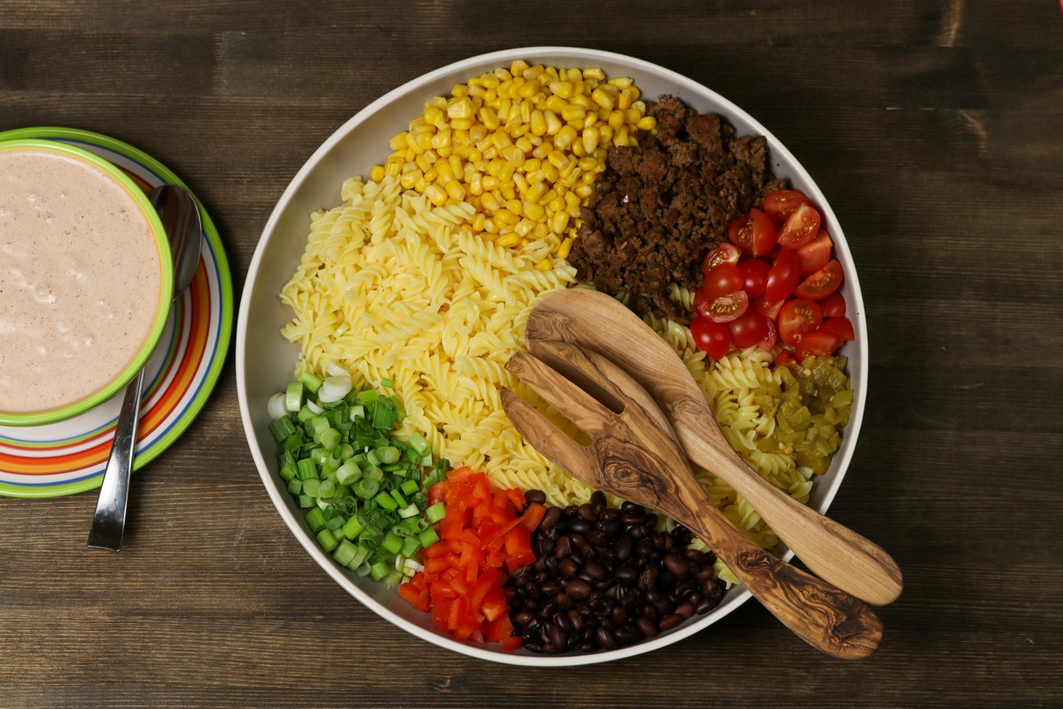 Ingredients for gluten-free Mexican pasta salad in brightly coloured bowl