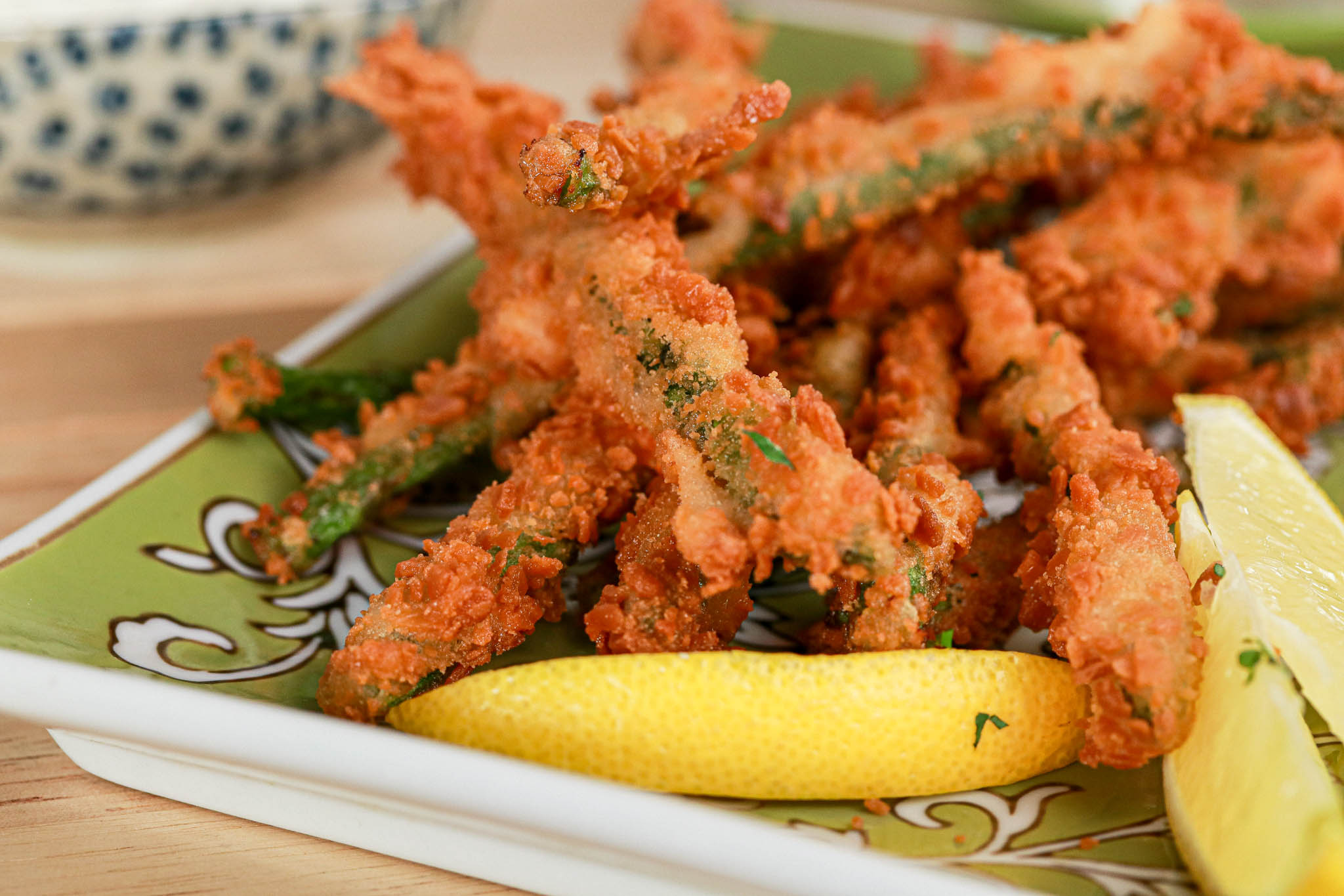 Gluten-free Panko Asparagus on green plate, dinner scene