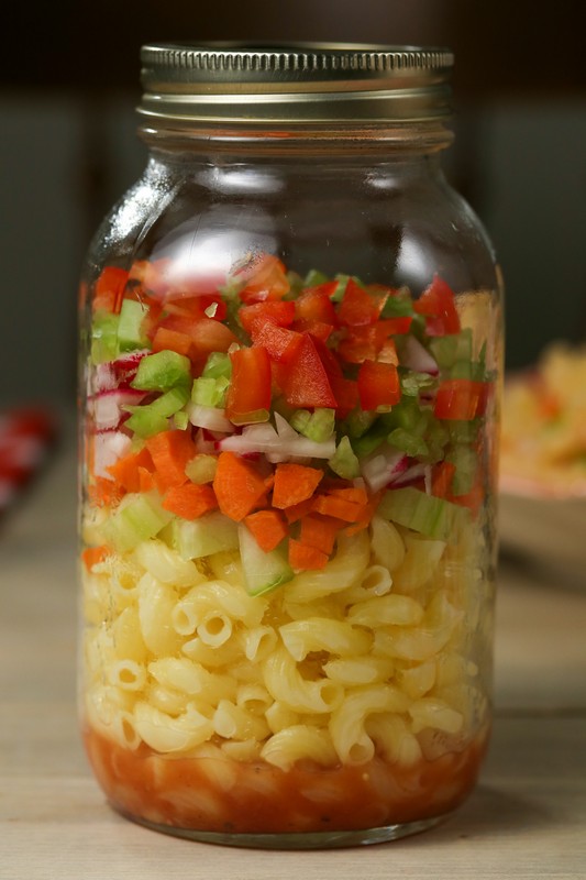 Summertime Pasta Salad in Mason Jar on wooden board